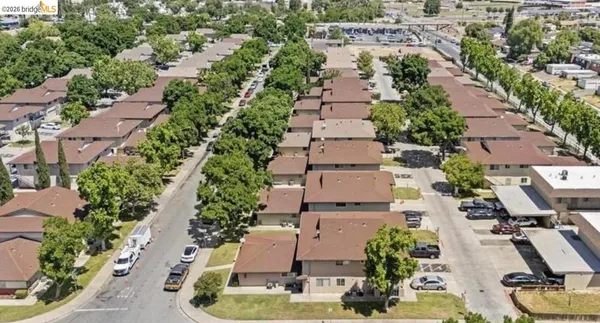 an aerial view of a house with outdoor space
