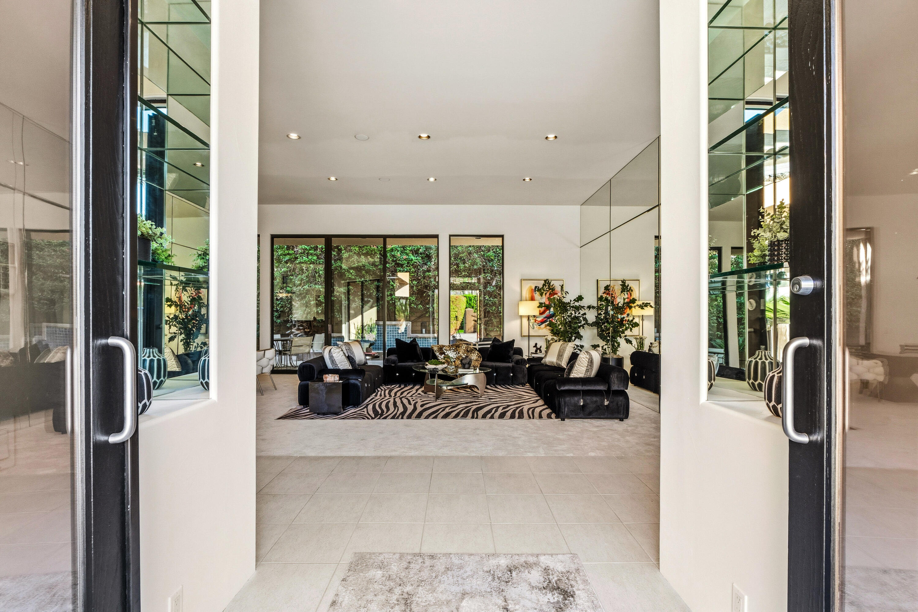 50120 Indian Camp Road La Quinta, CA 92253 - Photo 2 of 28 a lobby with furniture and floor to ceiling window
