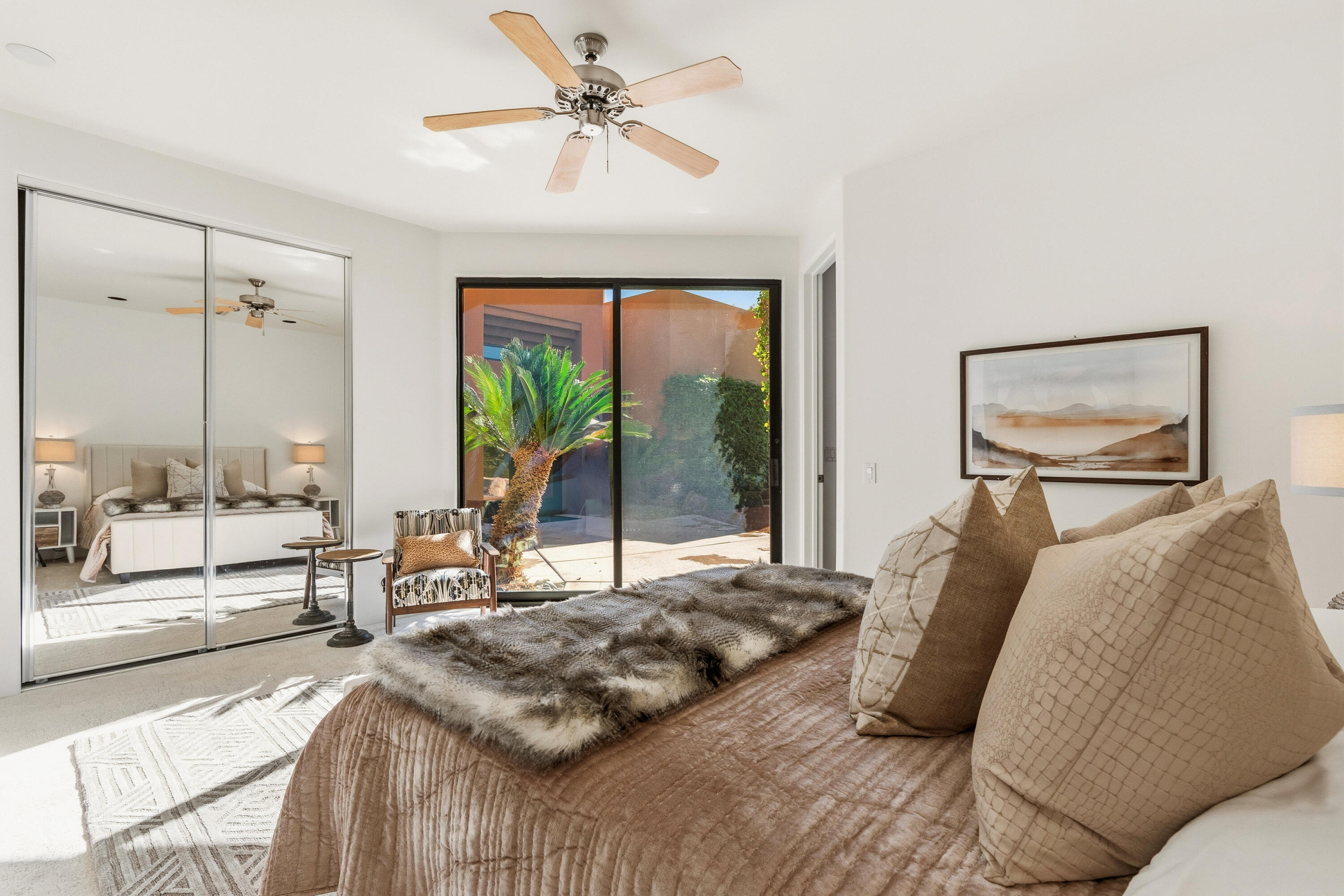 50120 Indian Camp Road La Quinta, CA 92253 - Photo 24 of 28 a bedroom with a bed and large mirror