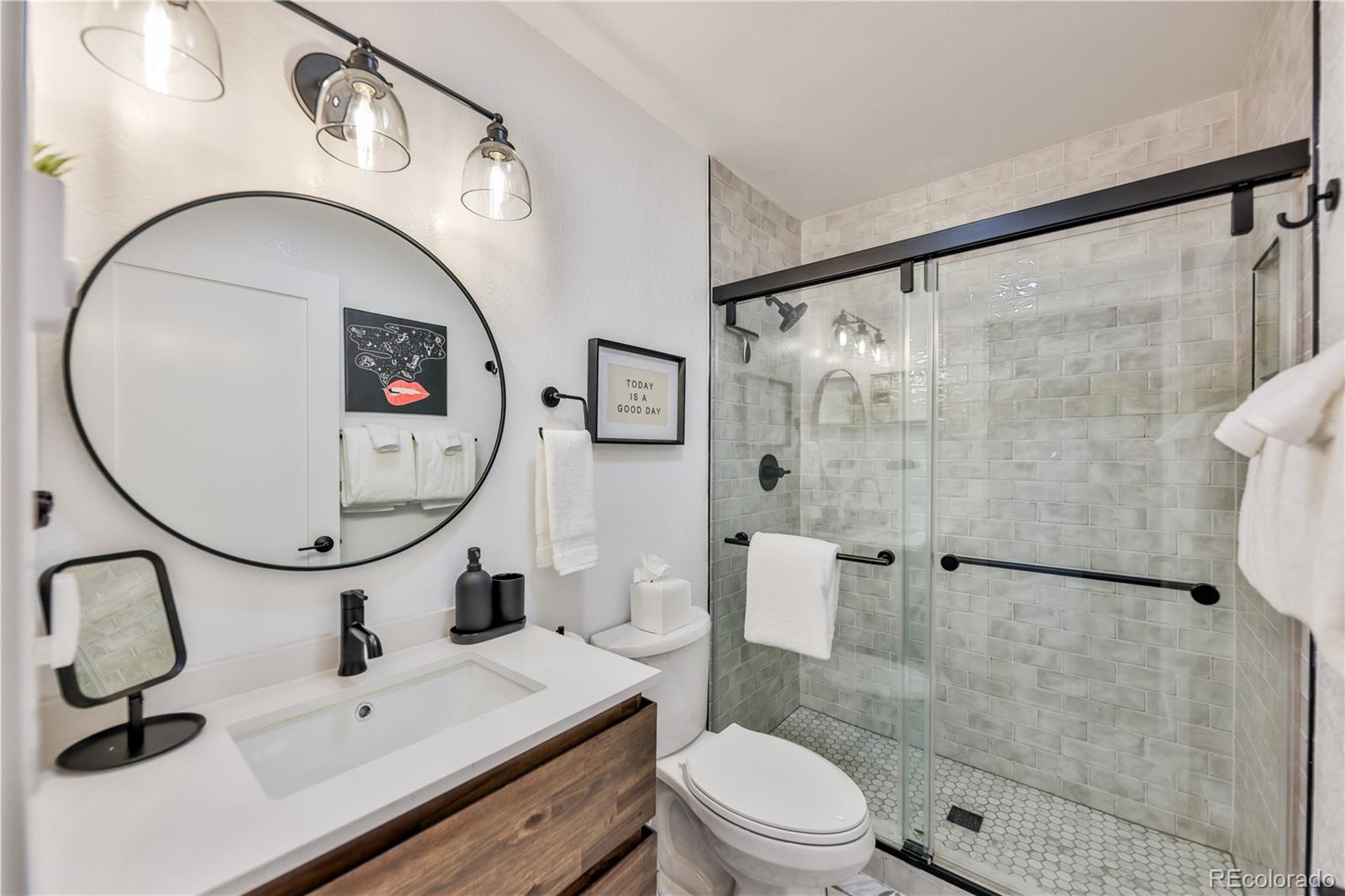 99 Doc Susie Avenue, Unit B6 Fraser, CO 80442 - Photo 12 of 25 a bathroom with a sink a toilet and a mirror