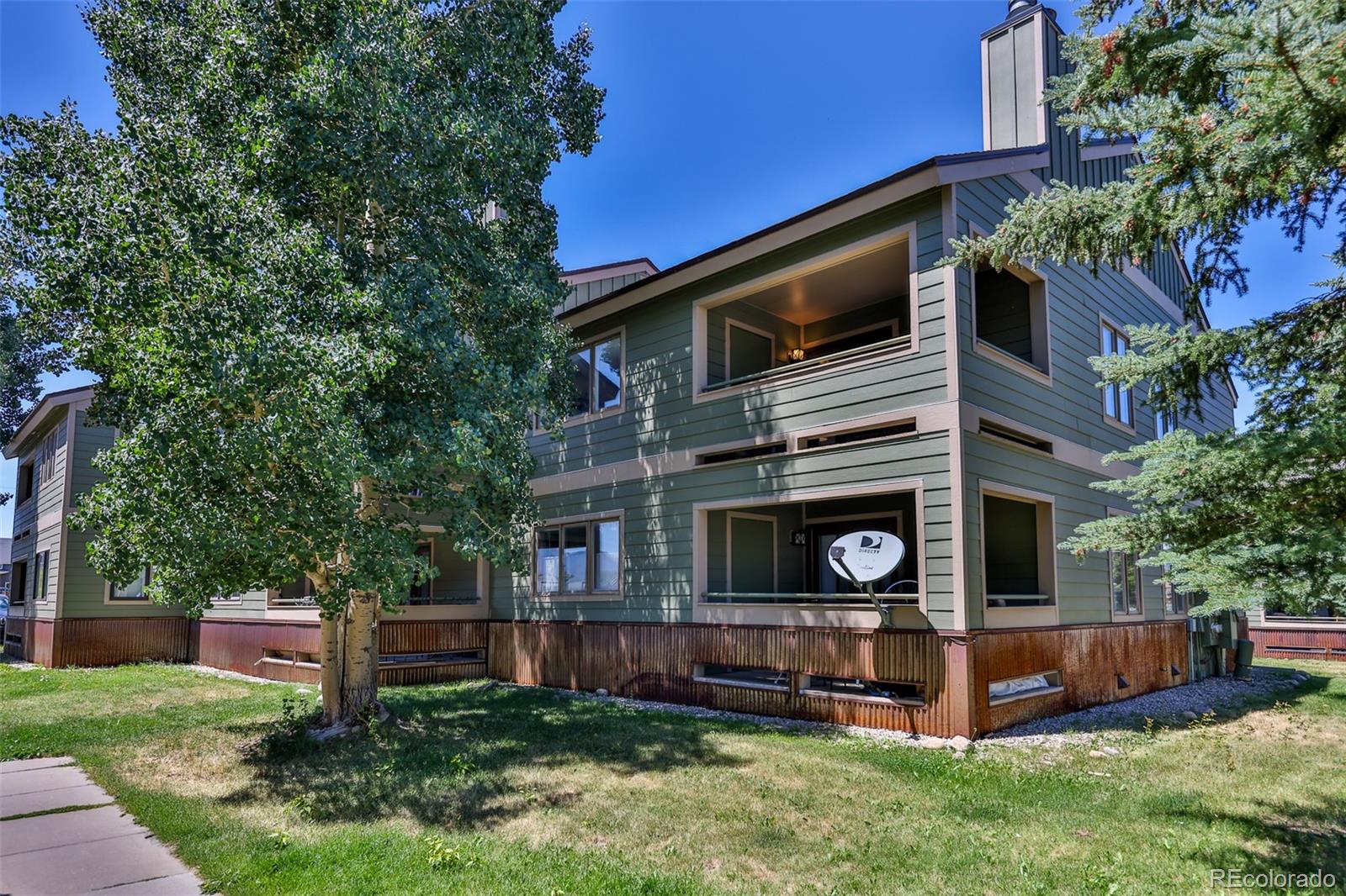 99 Doc Susie Avenue, Unit B6 Fraser, CO 80442 - Photo 18 of 25 a view of an house with backyard space and garden