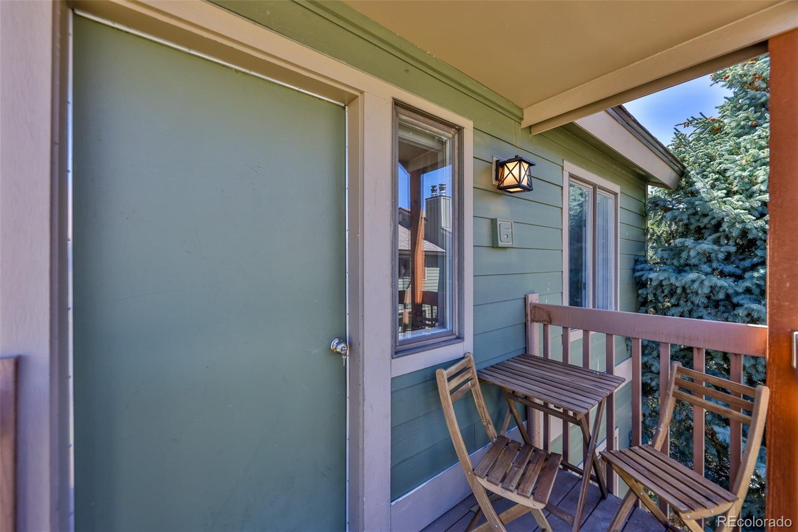99 Doc Susie Avenue, Unit B6 Fraser, CO 80442 - Photo 20 of 25 a view of a balcony with furniture and floor to ceiling window
