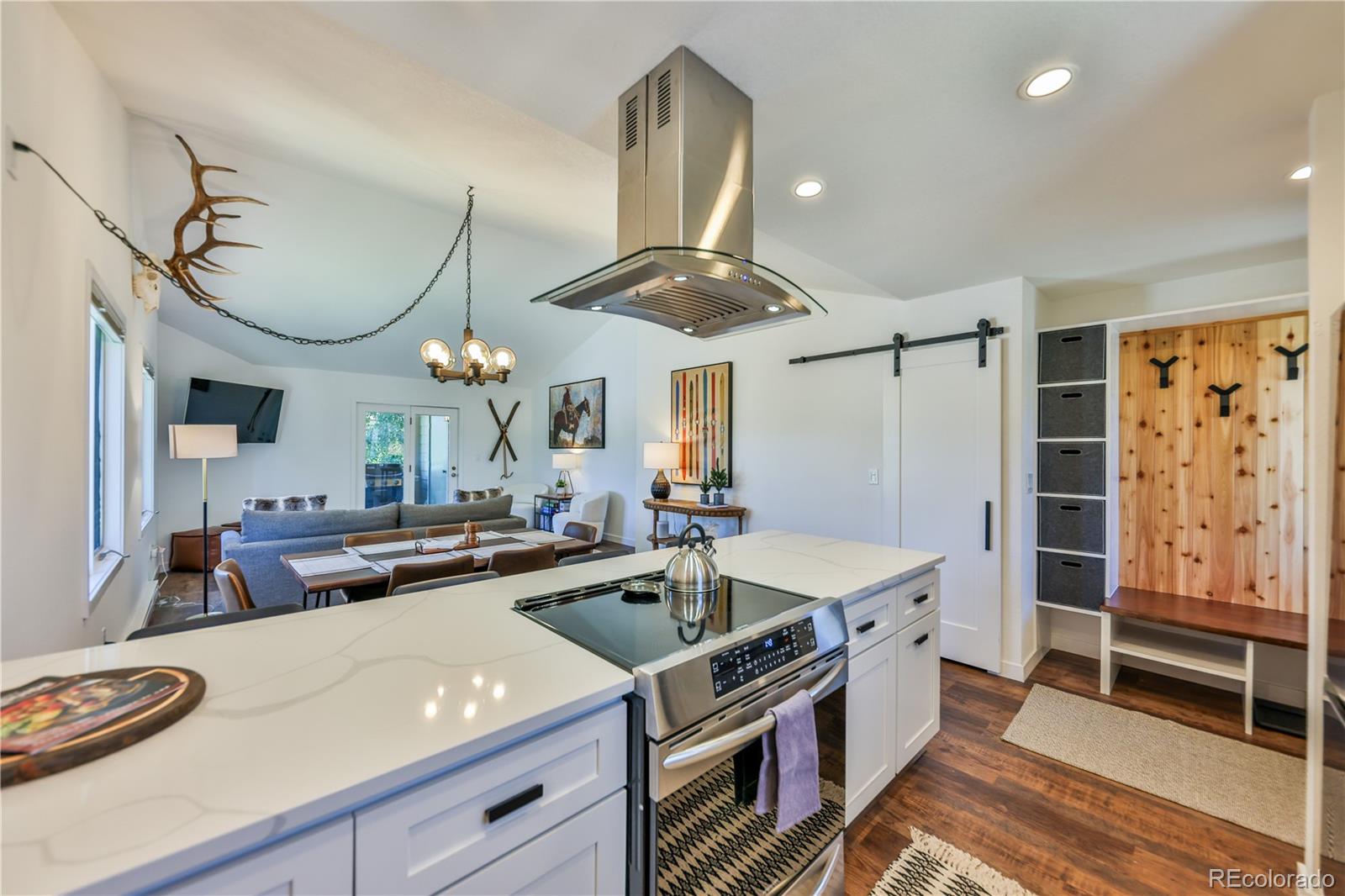 99 Doc Susie Avenue, Unit B6 Fraser, CO 80442 - Photo 3 of 25 a kitchen with a stove and a refrigerator