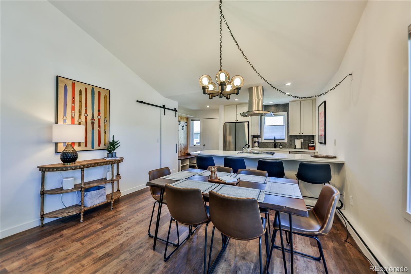 99 Doc Susie Avenue, Unit B6 Fraser, CO 80442 - Photo 7 of 25 a view of a dining room with furniture and wooden floor