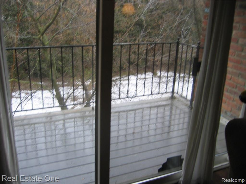 PRIVATE BALCONY OVER LOOKING WOODED AREA