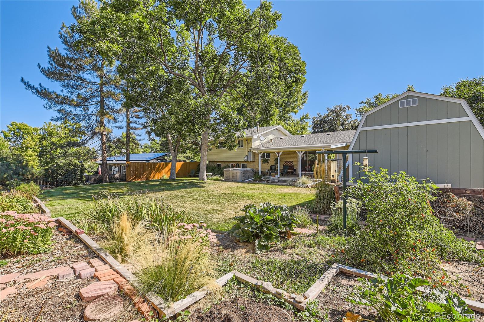 10471 Romblon Way Northglenn, CO 80234 - Photo 11 of 11 a front view of a house with a garden