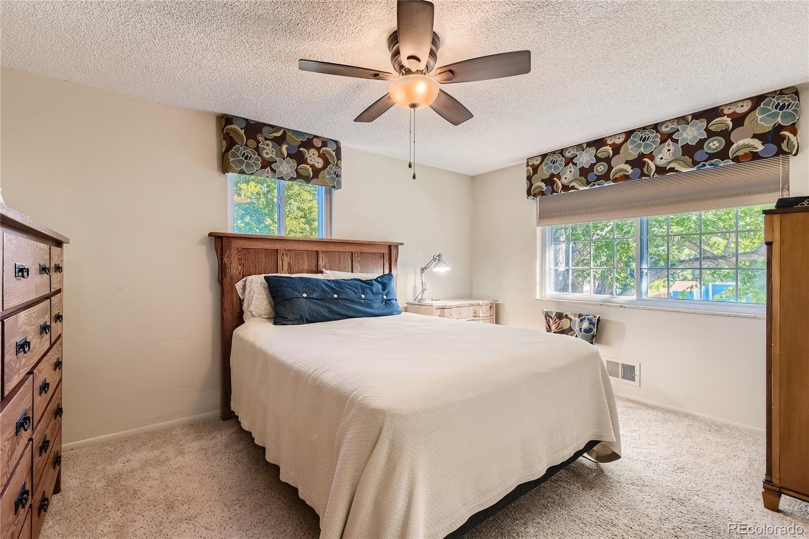 10471 Romblon Way Northglenn, CO 80234 - Photo 5 of 11 a bedroom with a bed and a window