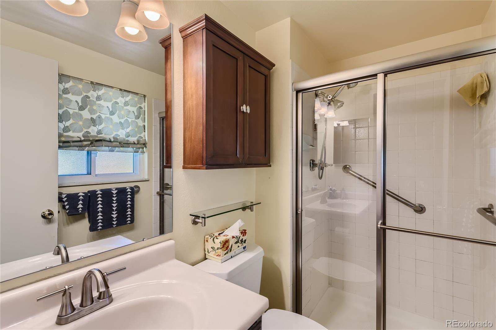 10471 Romblon Way Northglenn, CO 80234 - Photo 6 of 11 a bathroom with a sink toilet and shower