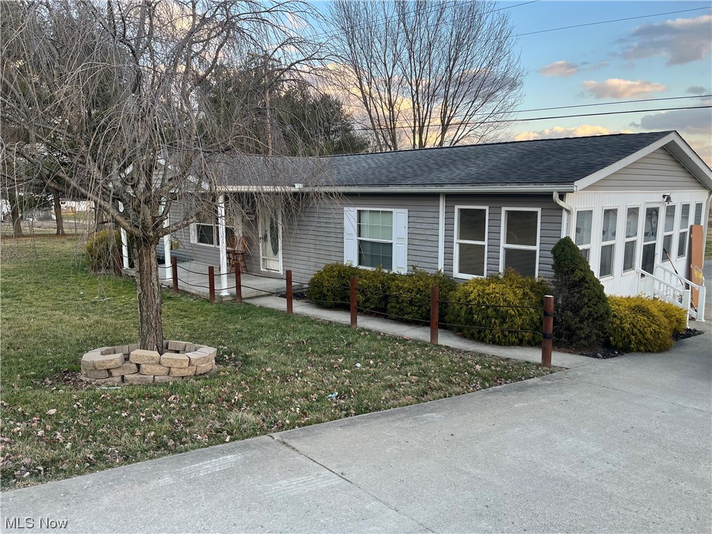 59062 Marietta Road Byesville, OH 43723 - Photo 2 of 33 Single story home featuring a yard and a fire pit