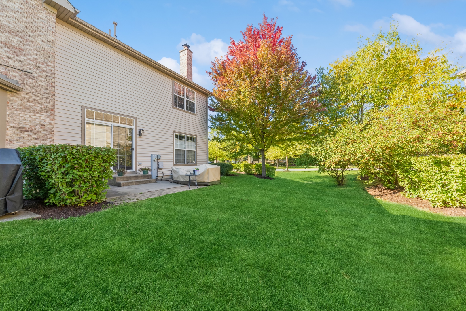 5561 McDonough Road Hoffman Estates, IL 60192 - Photo 16 of 16 a front view of a house with garden