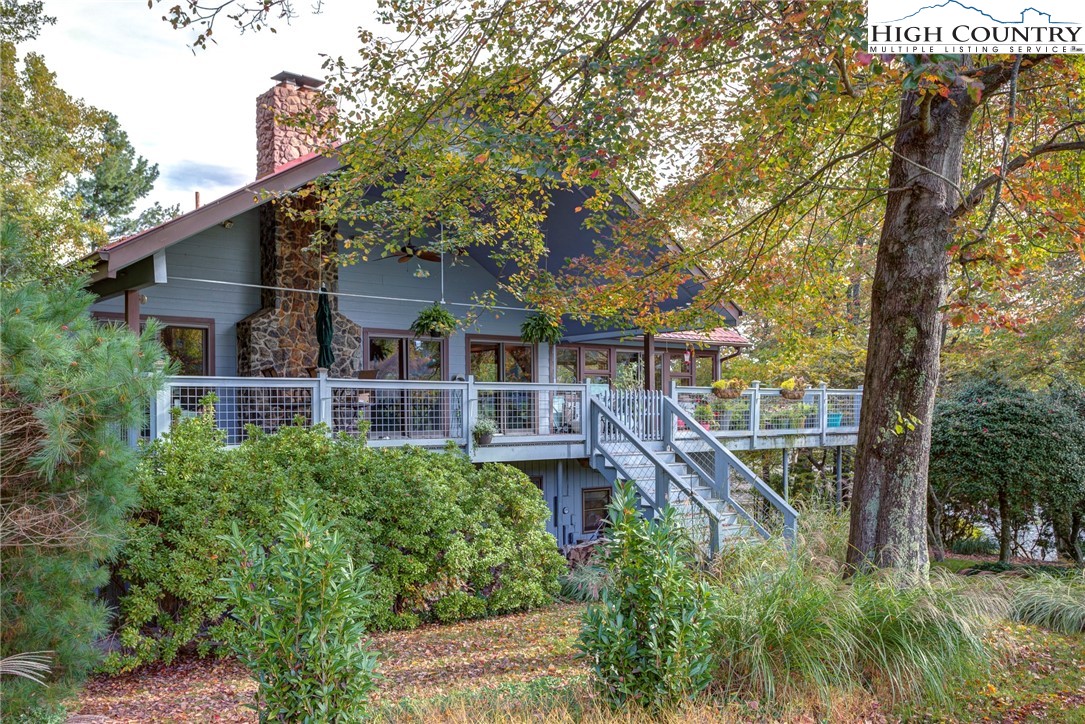 249 Red Bird Lane Glade Valley, NC 28627 - Photo 29 of 41 front view of a house with a tree