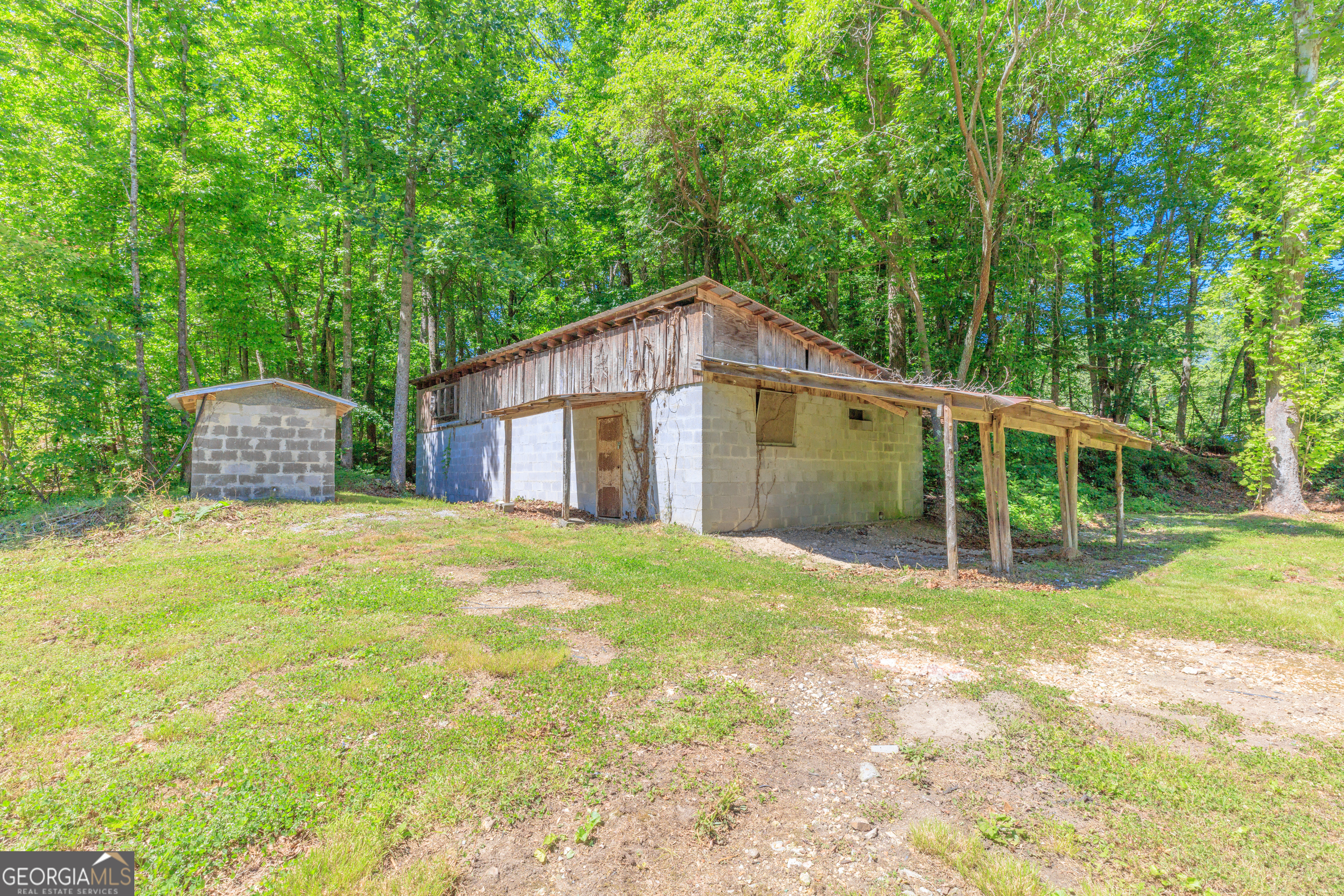 1004 Crow Gap Road Chickamauga, GA 30707 - Photo 25 of 36 a view of a house with backyard and trees