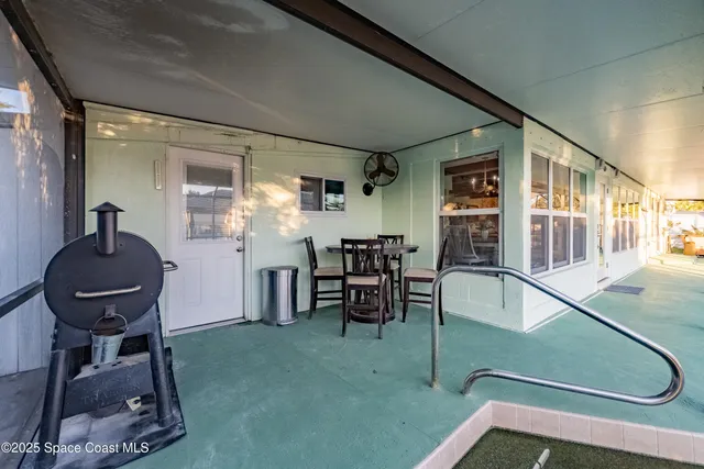 a view of a swimming pool with a patio