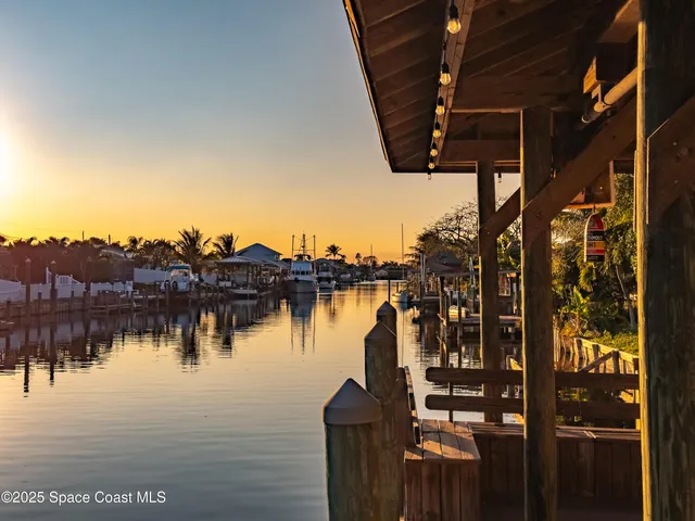 a kitchen with stainless steel appliances kitchen island granite countertop a sink and cabinets