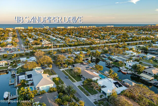 a kitchen with refrigerator and cabinets