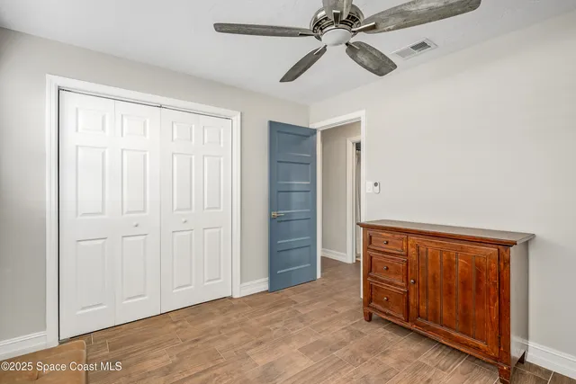 a view of a tree in front of a house