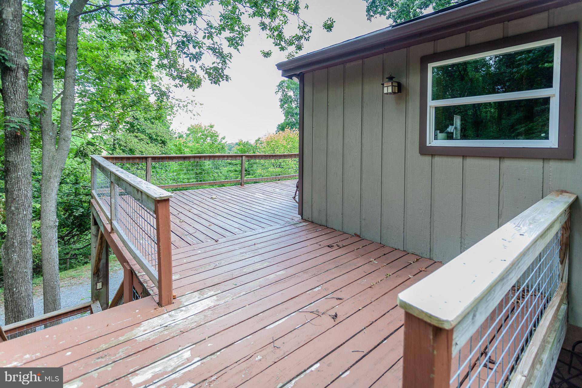 2668 Pine Grove Road Stanley, VA 22851 - Photo 11 of 35 a view of deck with wooden floor and fence with a garden view