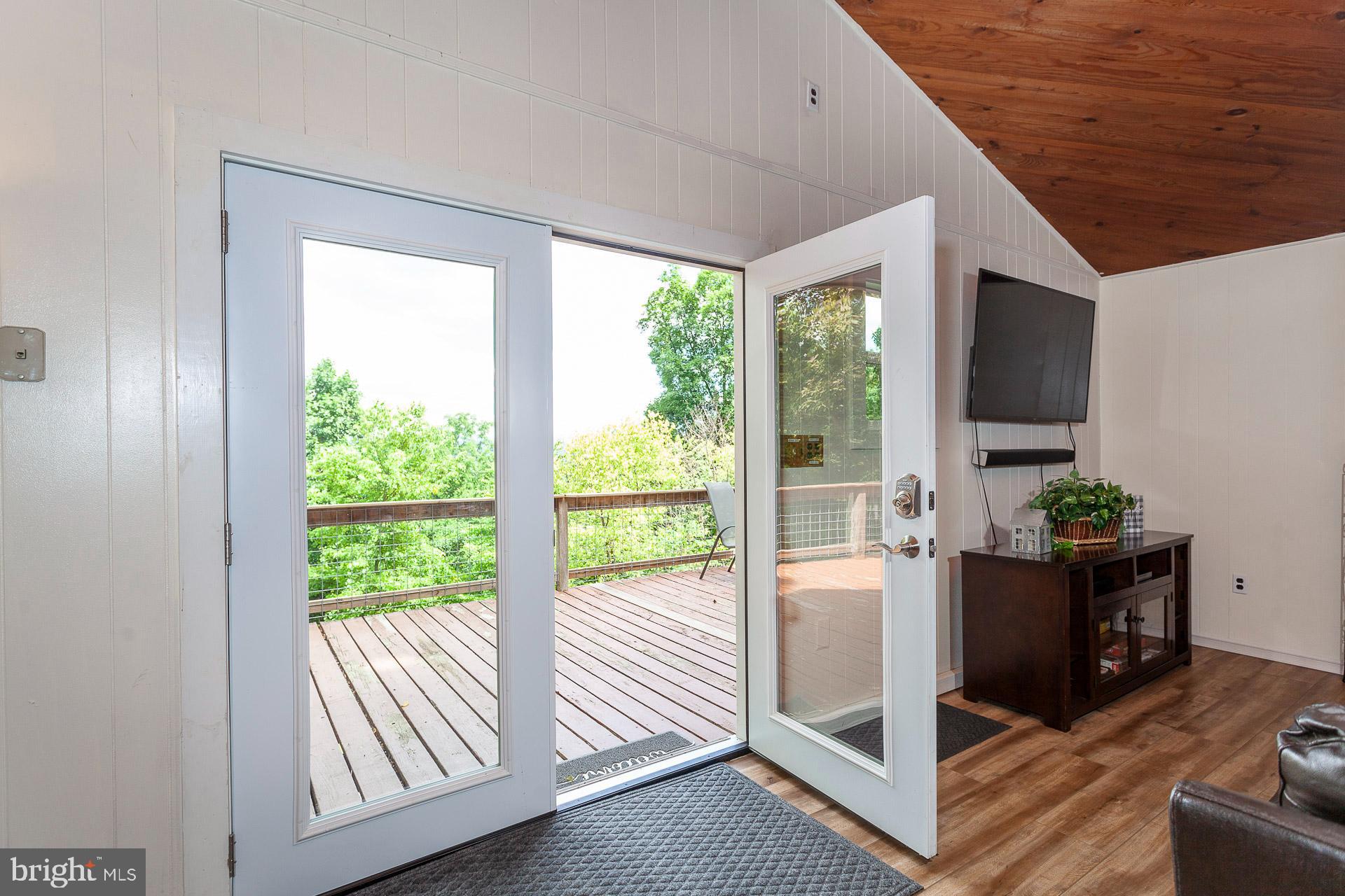 2668 Pine Grove Road Stanley, VA 22851 - Photo 15 of 35 a view of a livingroom with furniture wooden floor and windows
