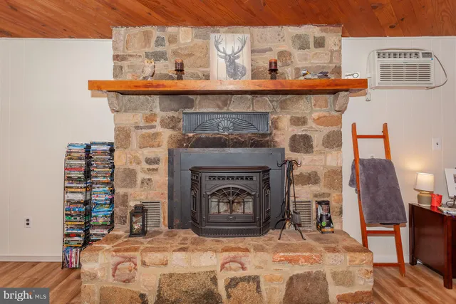a bedroom with a bed and a fireplace