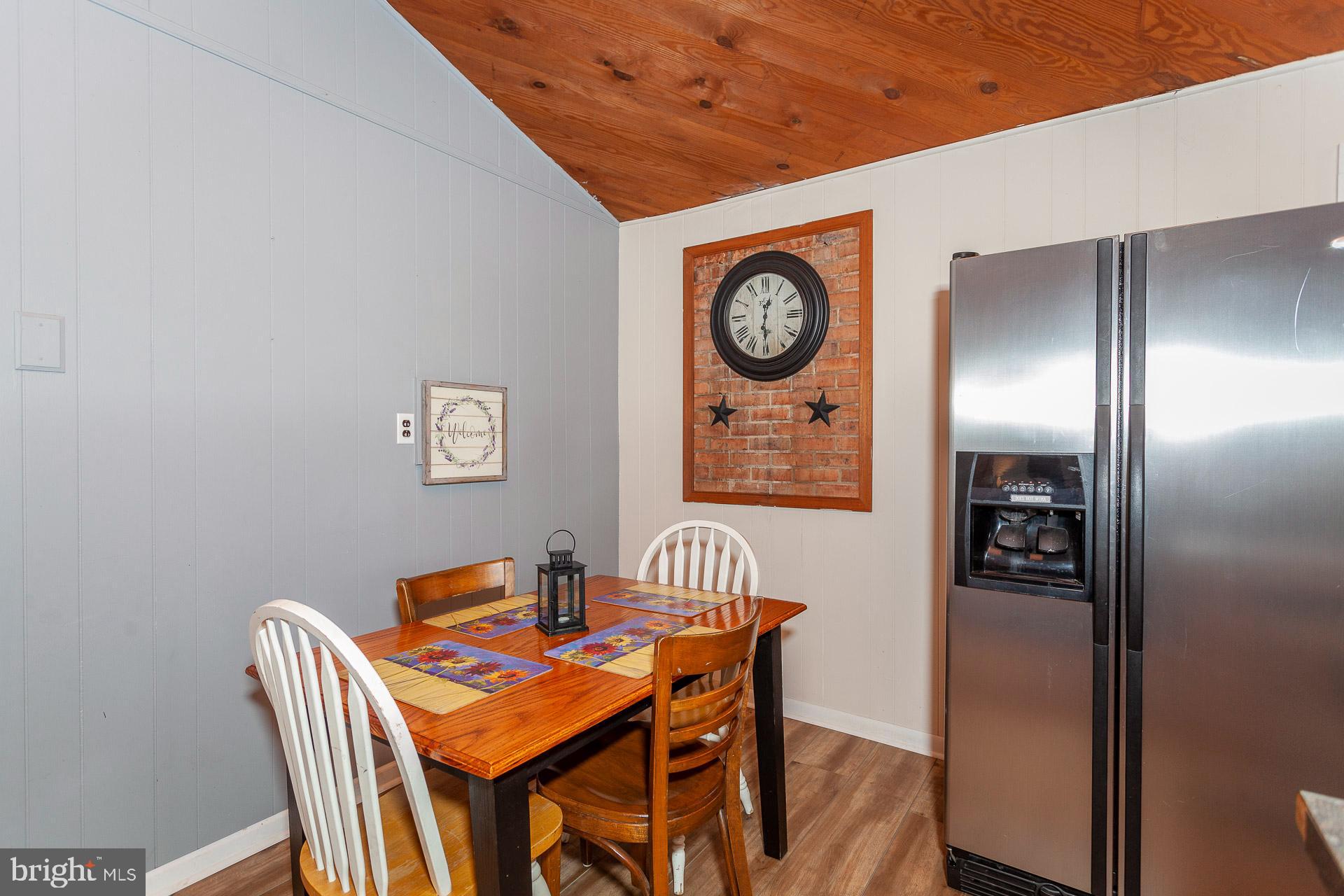 2668 Pine Grove Road Stanley, VA 22851 - Photo 26 of 35 a dining room with a wooden table and chairs