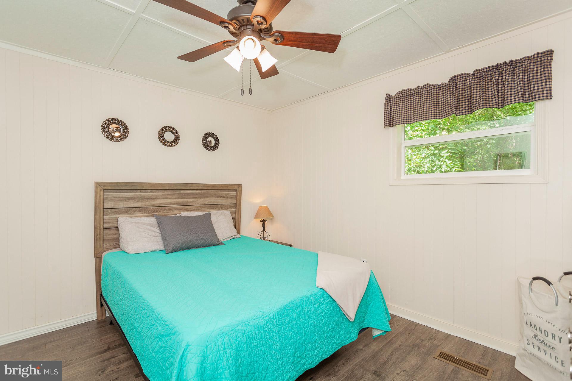 2668 Pine Grove Road Stanley, VA 22851 - Photo 27 of 35 a room with a bed and a large window