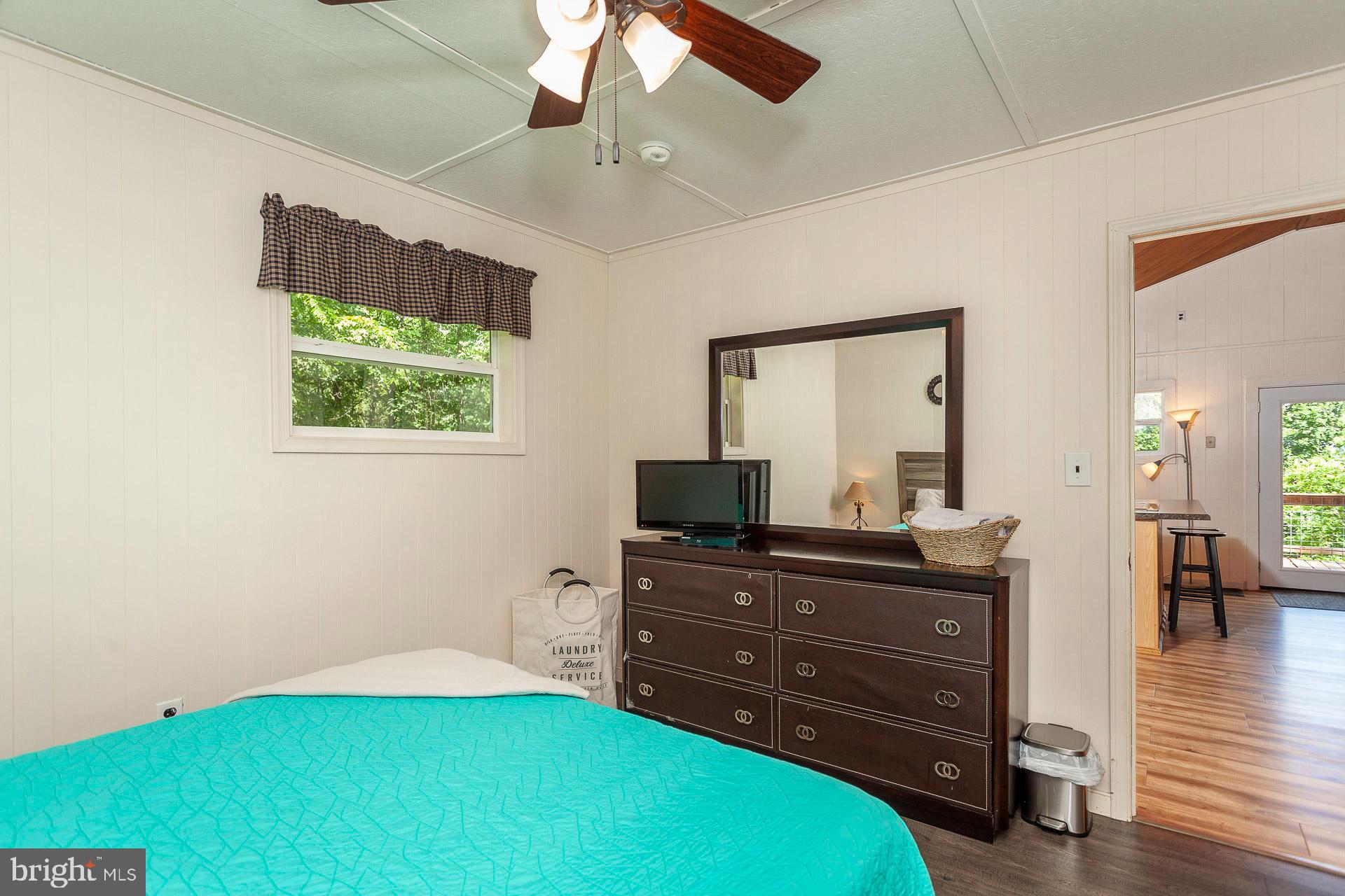 2668 Pine Grove Road Stanley, VA 22851 - Photo 29 of 35 a room with a bed and a television