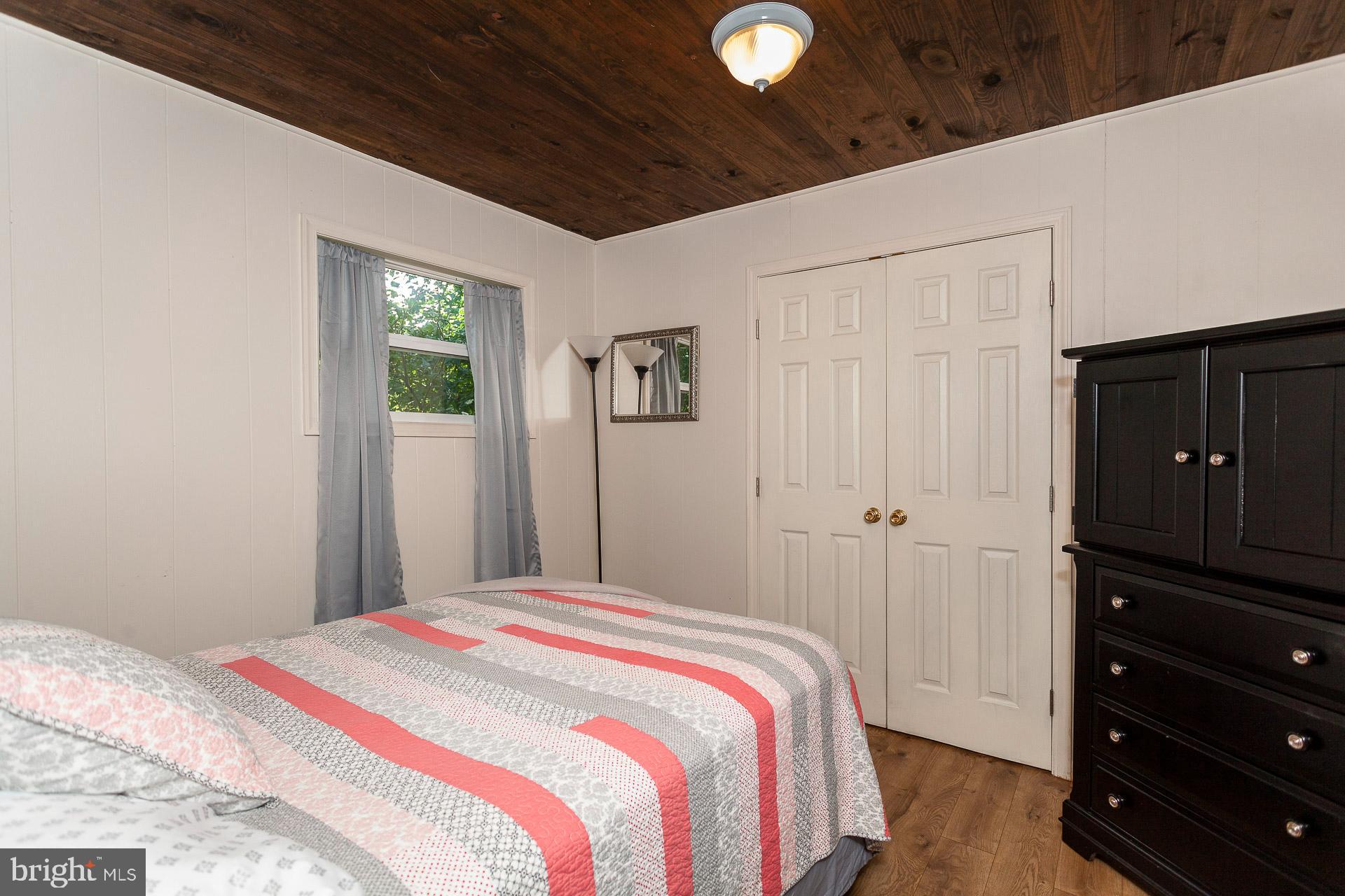 2668 Pine Grove Road Stanley, VA 22851 - Photo 31 of 35 a bedroom with a bed and a dresser