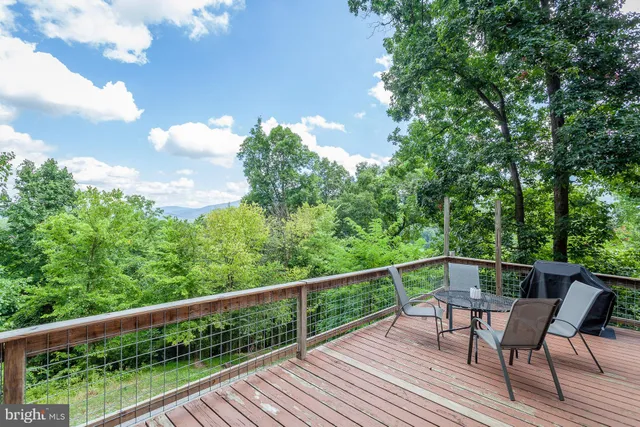 a view of a balcony with furniture