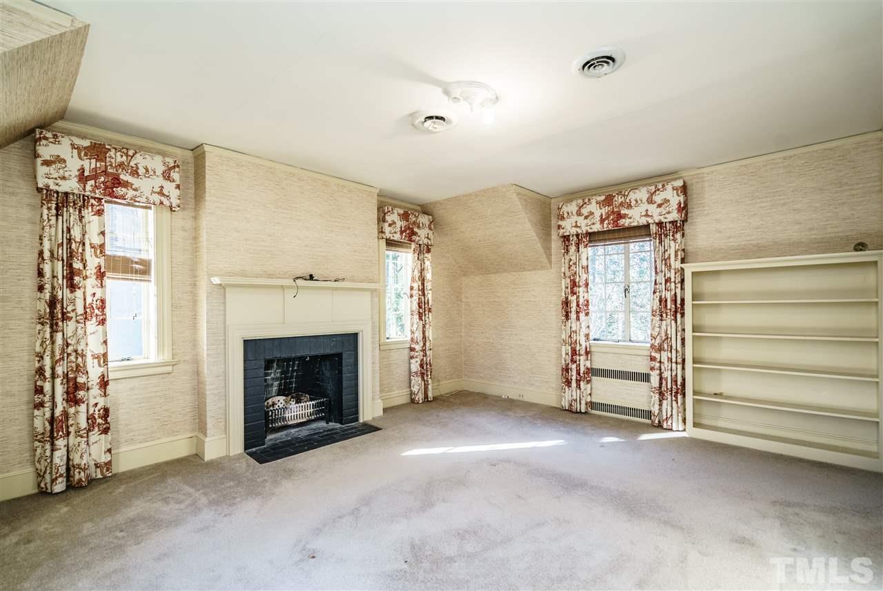 2515 White Oak Road Raleigh, NC 27609 - Photo 12 of 25 a view of a livingroom with a fireplace and window