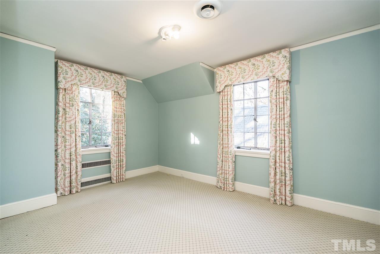 2515 White Oak Road Raleigh, NC 27609 - Photo 13 of 25 an empty room with windows and closet