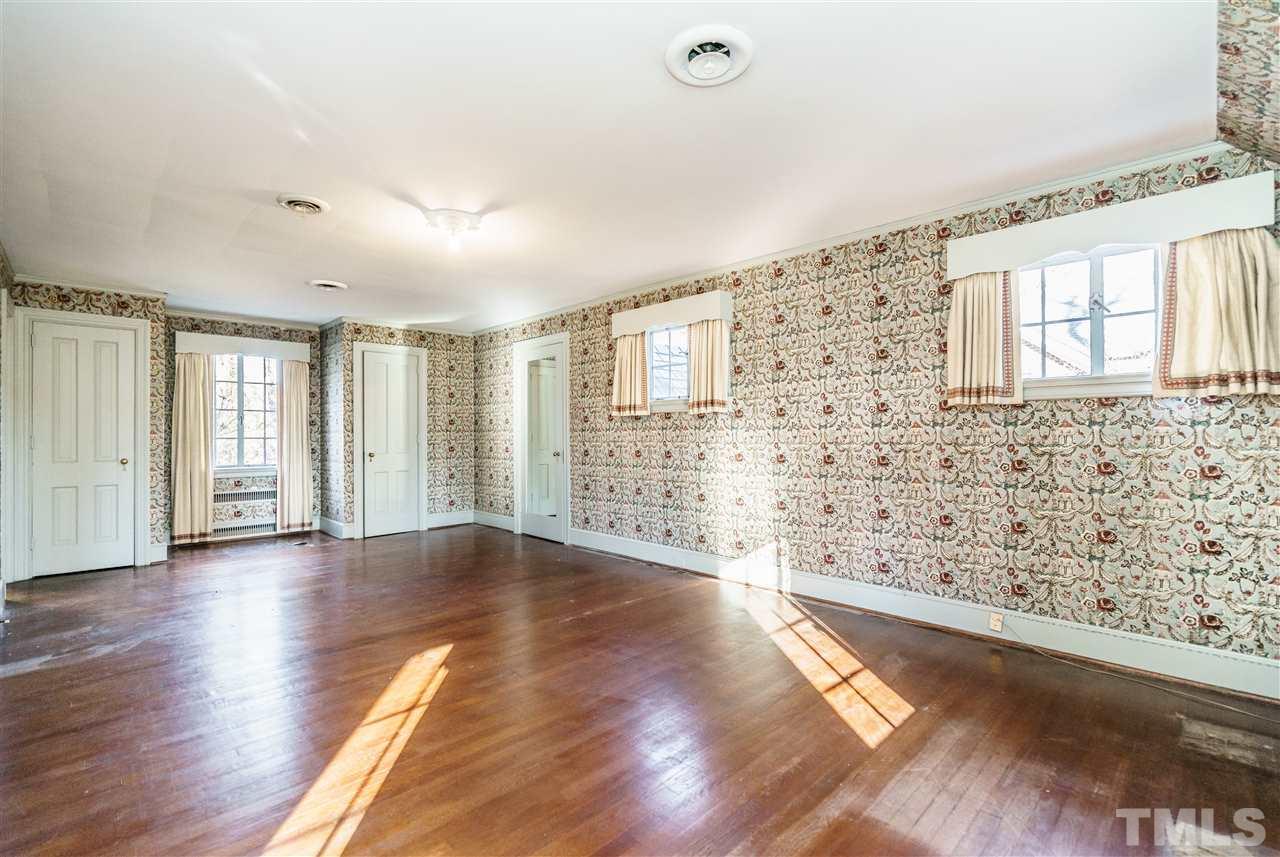 2515 White Oak Road Raleigh, NC 27609 - Photo 16 of 25 a view of an empty room with wooden floor and a window
