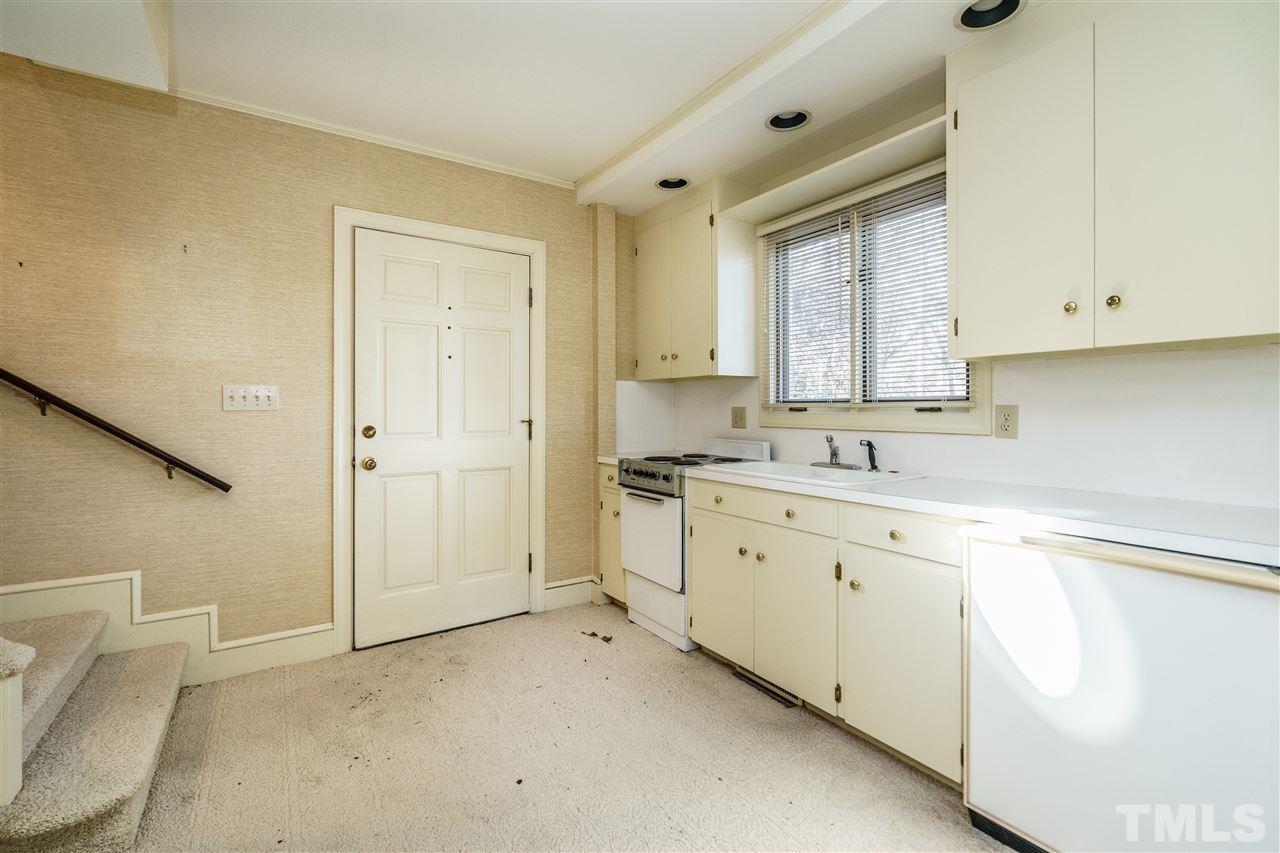 2515 White Oak Road Raleigh, NC 27609 - Photo 19 of 25 a spacious bathroom with a granite countertop sink mirror and a toilet