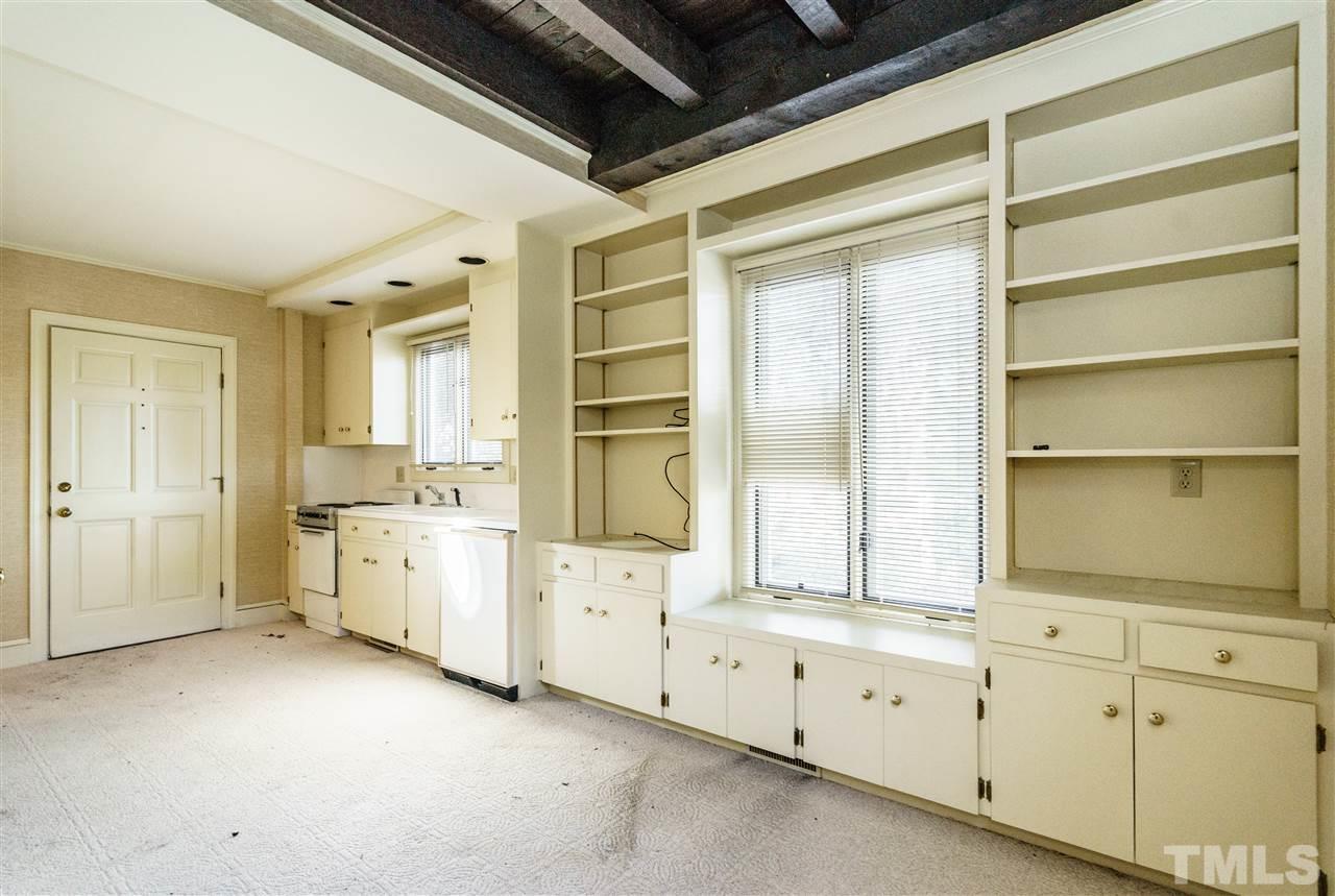 2515 White Oak Road Raleigh, NC 27609 - Photo 20 of 25 a room with dryer and cabinets