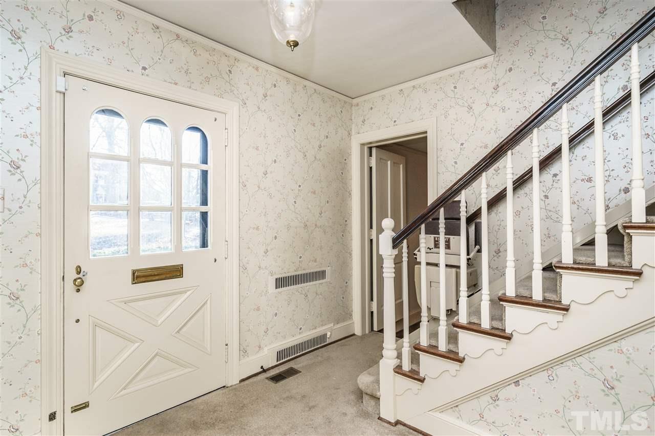 2515 White Oak Road Raleigh, NC 27609 - Photo 3 of 25 a view of entryway and hall with wooden floor