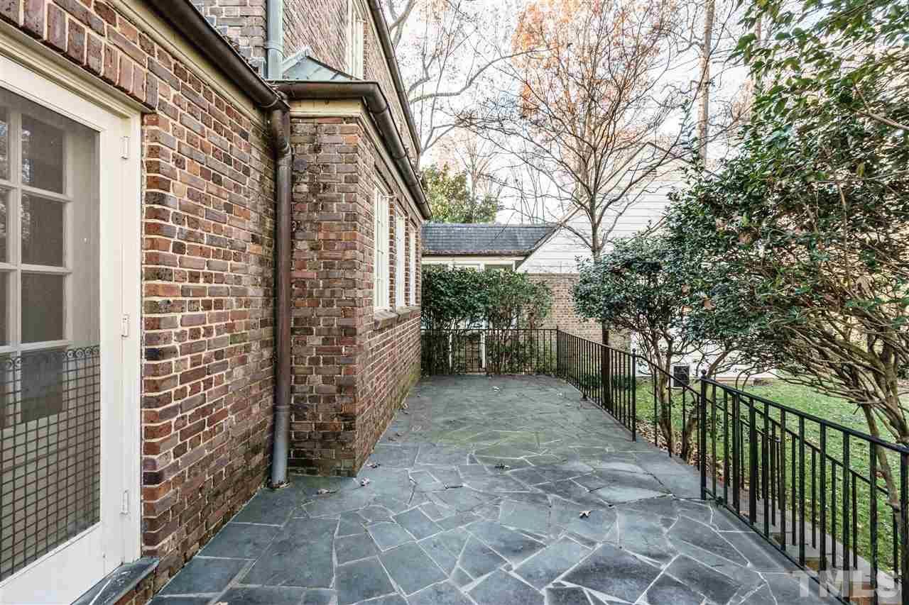 2515 White Oak Road Raleigh, NC 27609 - Photo 23 of 25 a view of a pathway along the house and trees