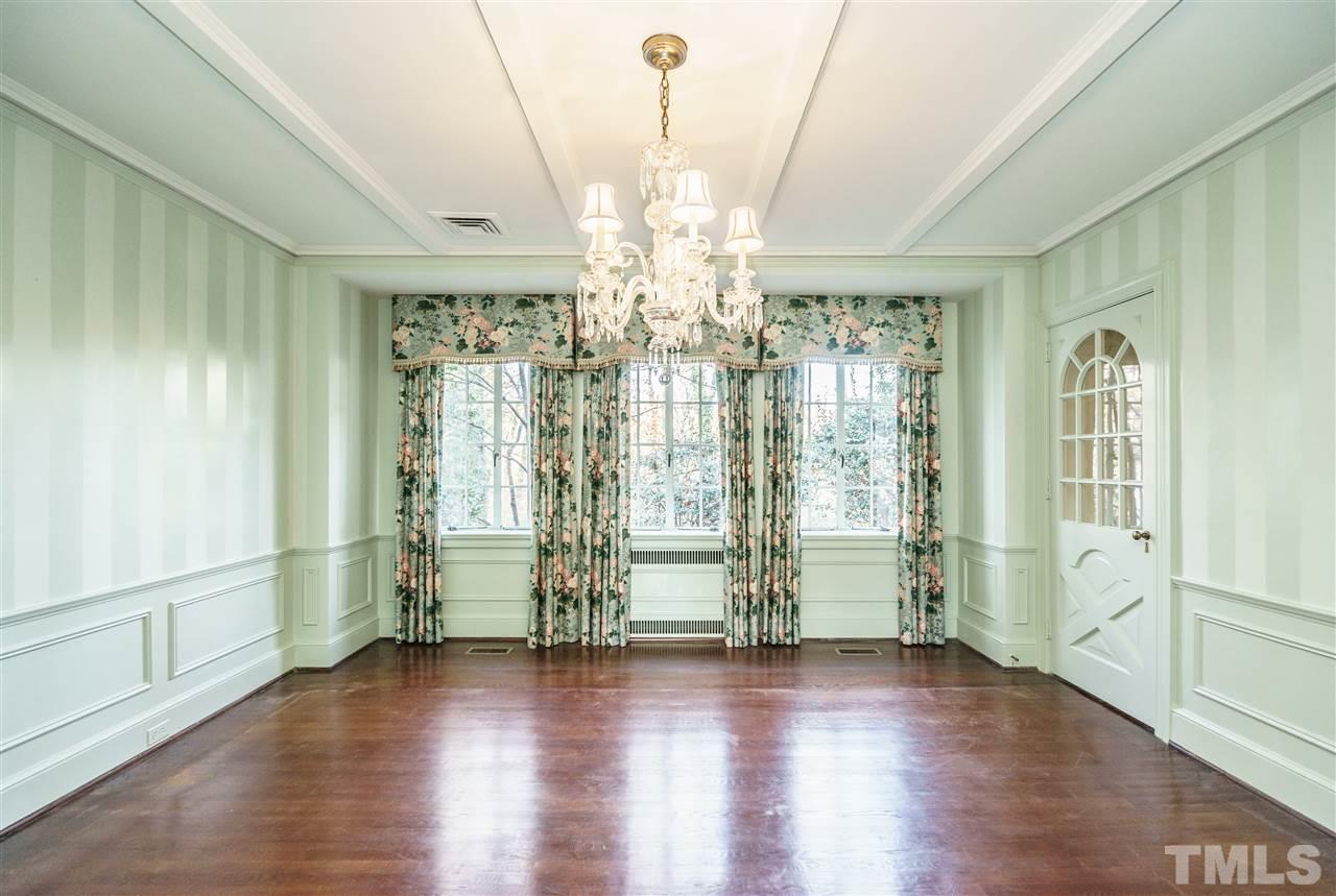 2515 White Oak Road Raleigh, NC 27609 - Photo 7 of 25 a view of an empty room with window and wooden floor