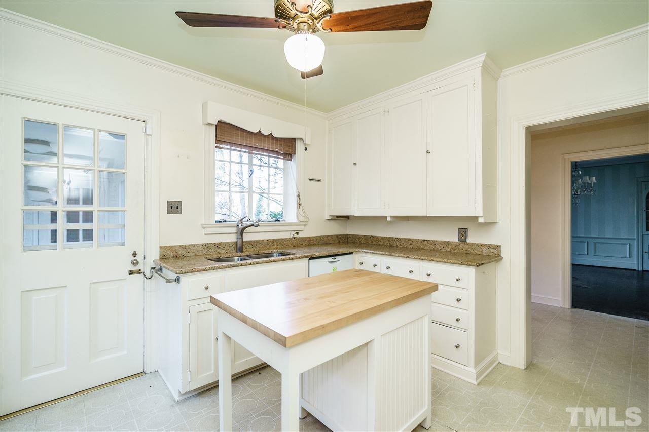 2515 White Oak Road Raleigh, NC 27609 - Photo 9 of 25 a view of a kitchen with a sink appliances and cabinets