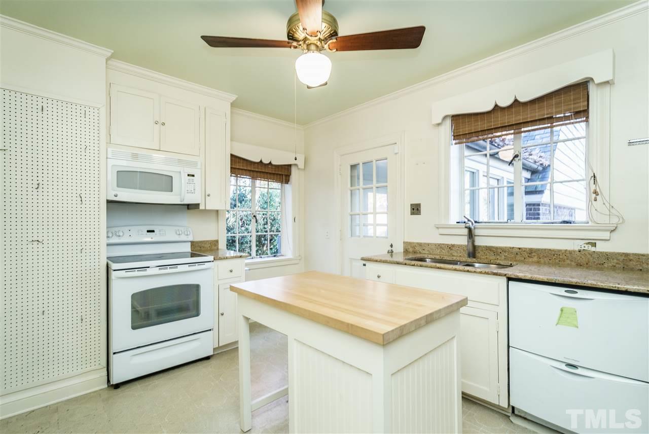 2515 White Oak Road Raleigh, NC 27609 - Photo 10 of 25 a kitchen with granite countertop a sink and stainless steel appliances