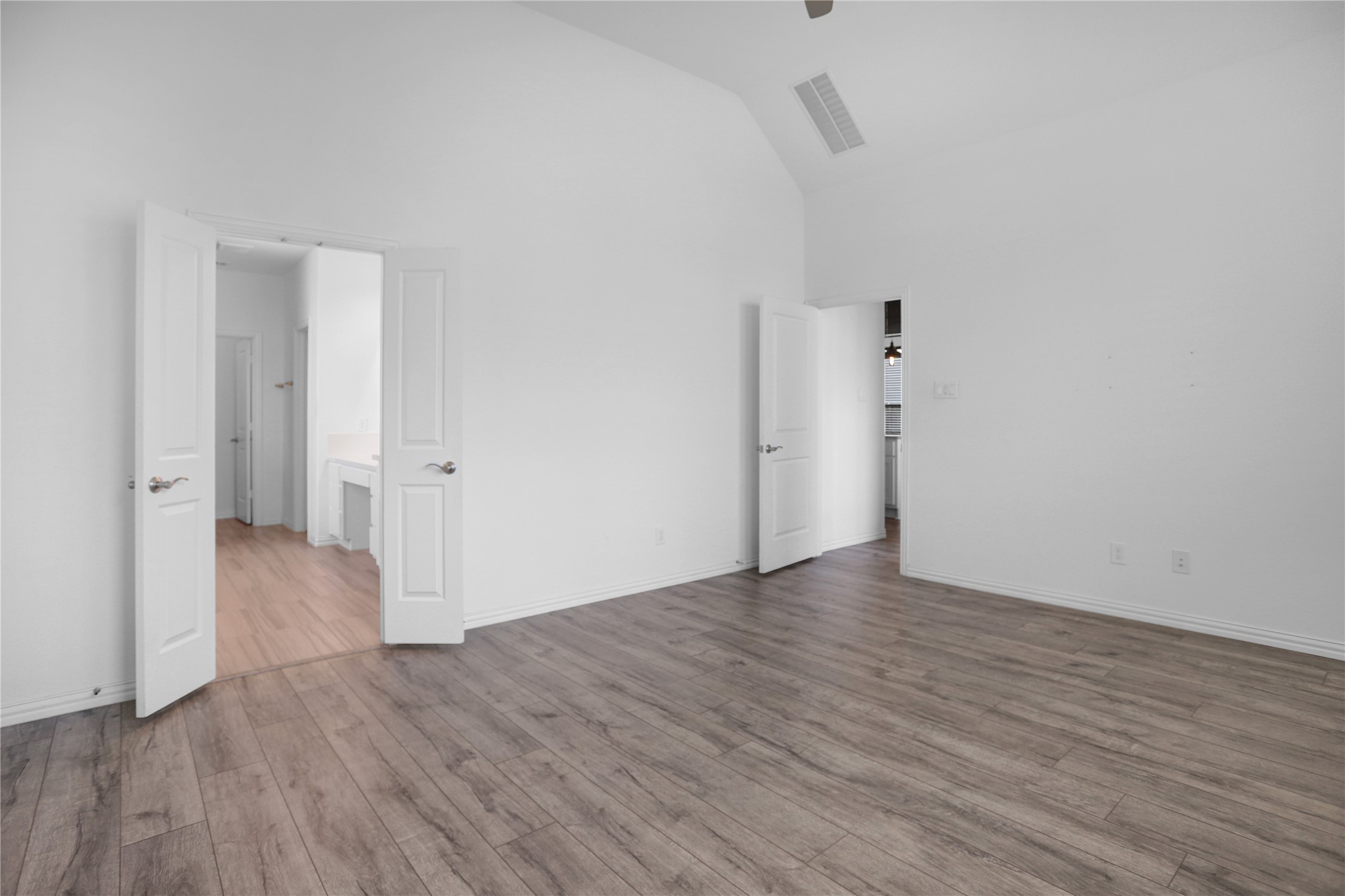 2718 Ripe Amber Cup Court Richmond, TX 77406 - Photo 12 of 43 a view of an empty room with wooden floor