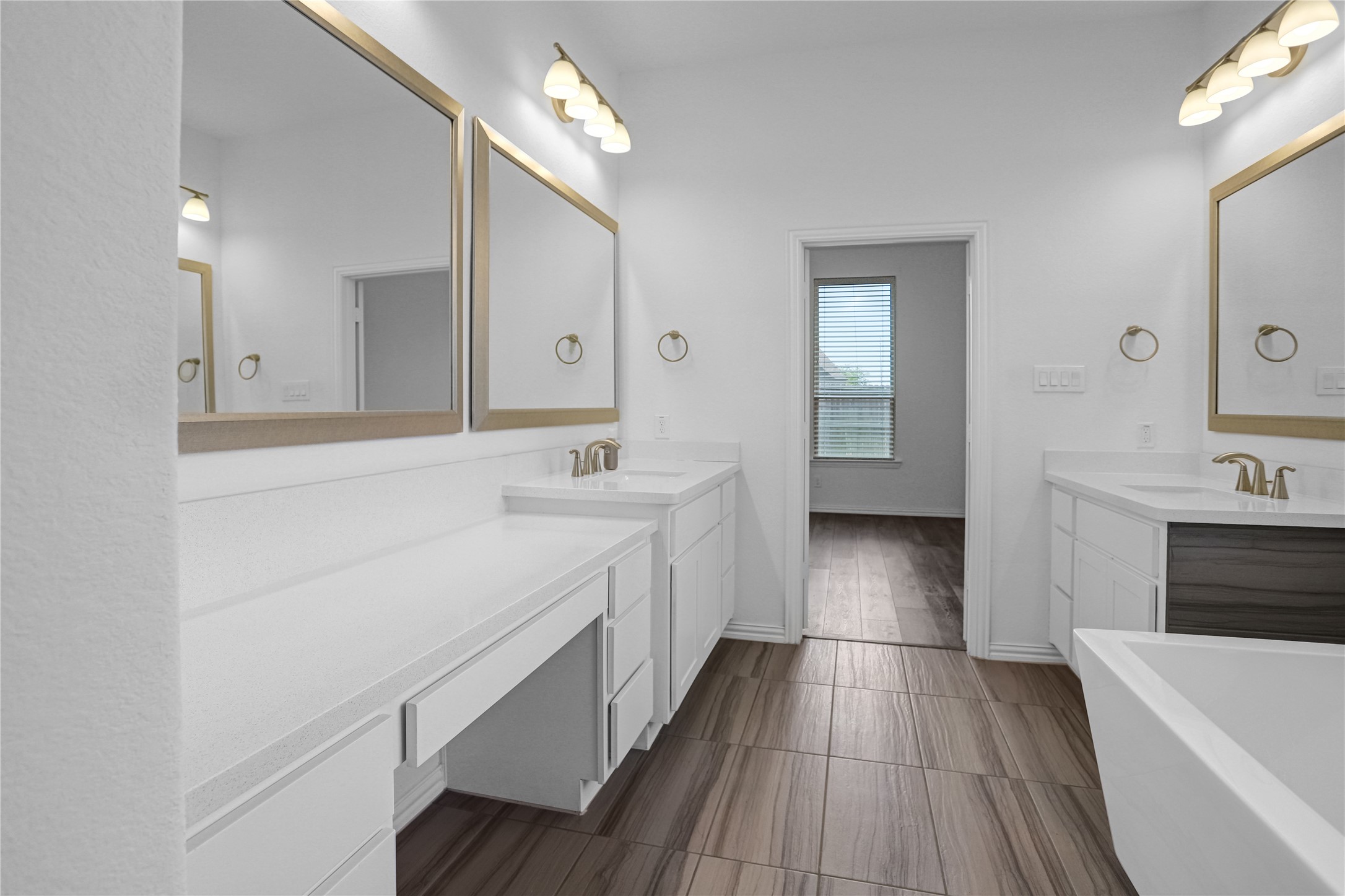 2718 Ripe Amber Cup Court Richmond, TX 77406 - Photo 14 of 43 a bathroom with a sink a mirror and a bathtub