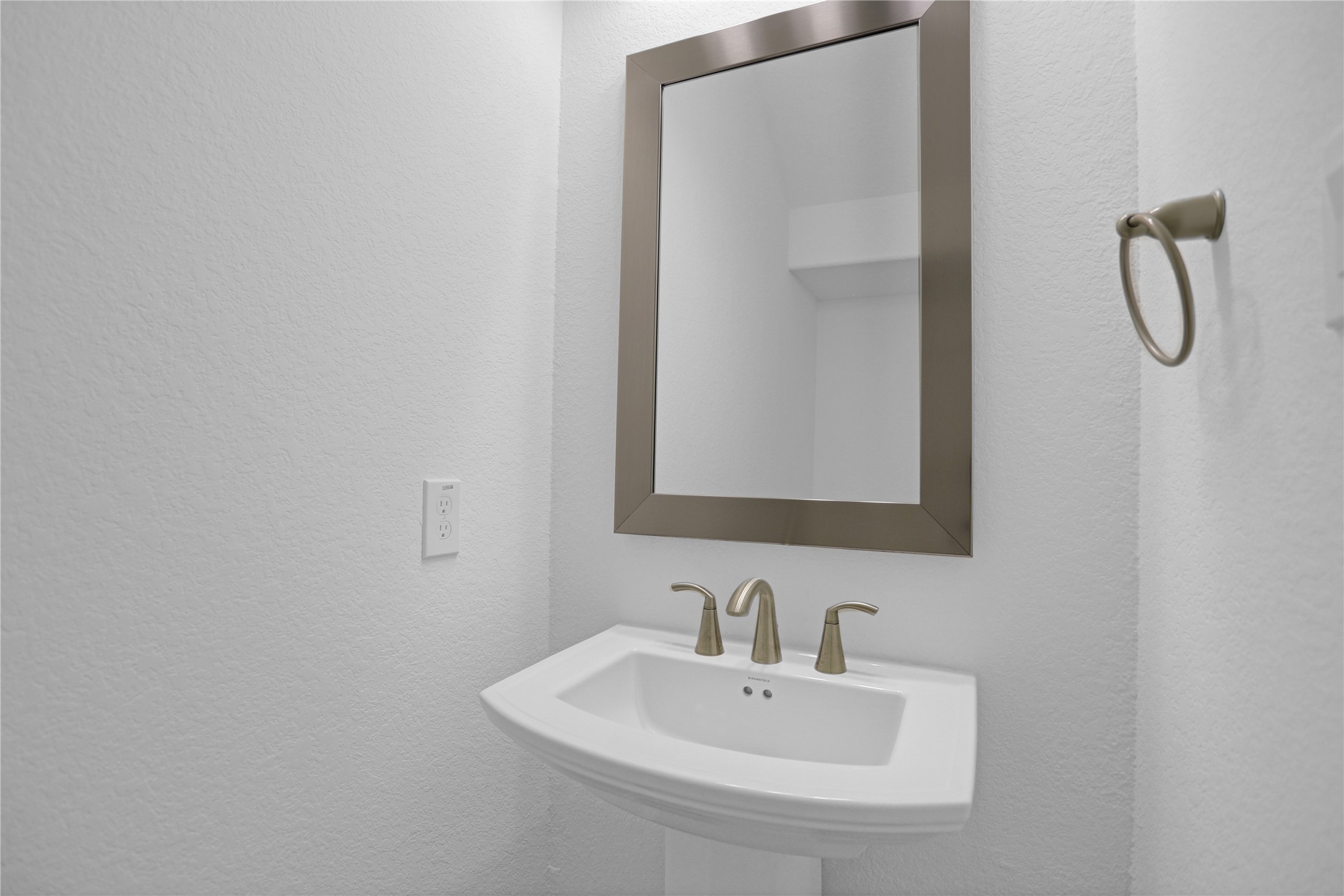 2718 Ripe Amber Cup Court Richmond, TX 77406 - Photo 20 of 43 a bathroom with a sink and mirror