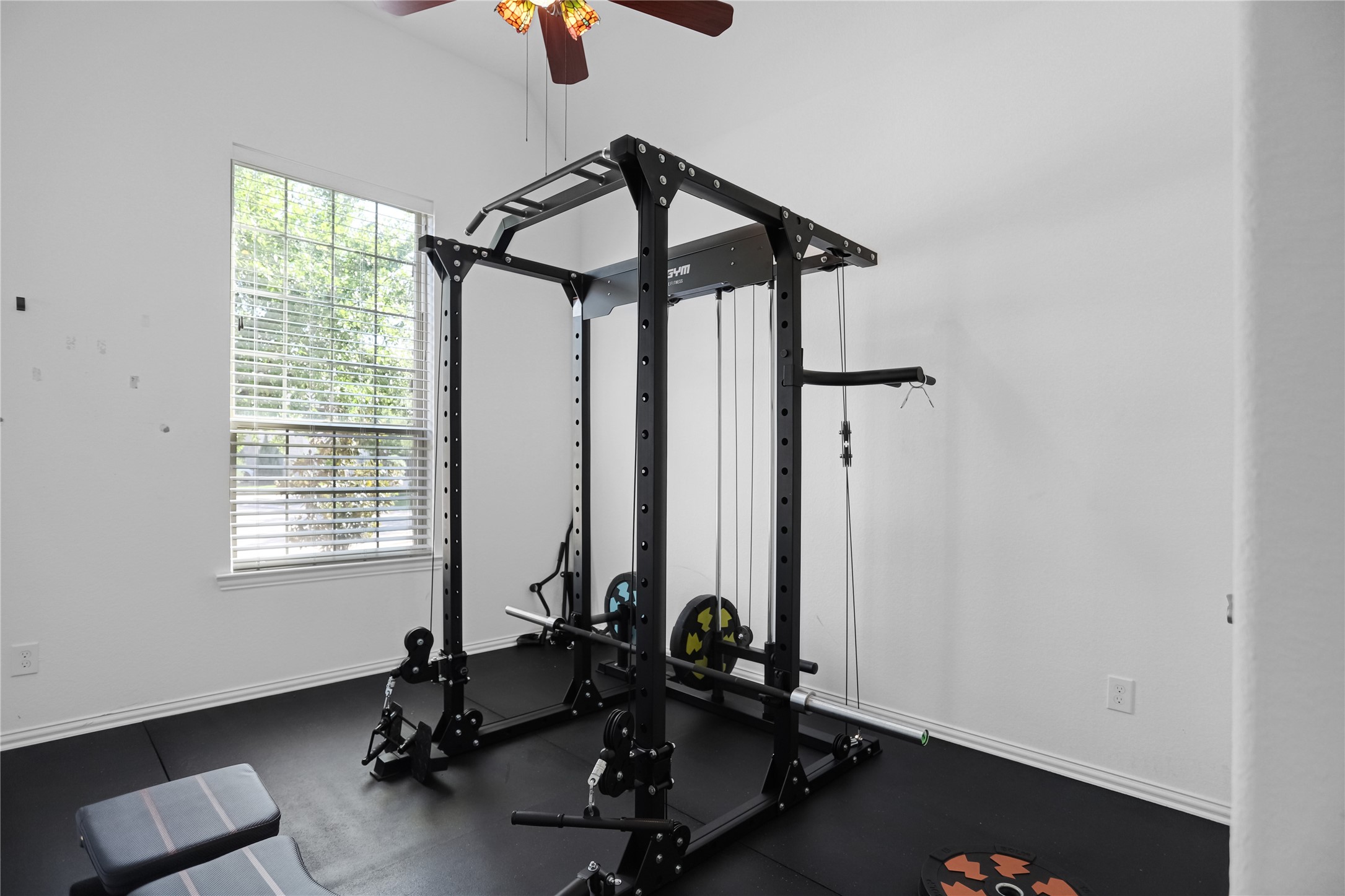 2718 Ripe Amber Cup Court Richmond, TX 77406 - Photo 21 of 43 a room with gym equipment and a window