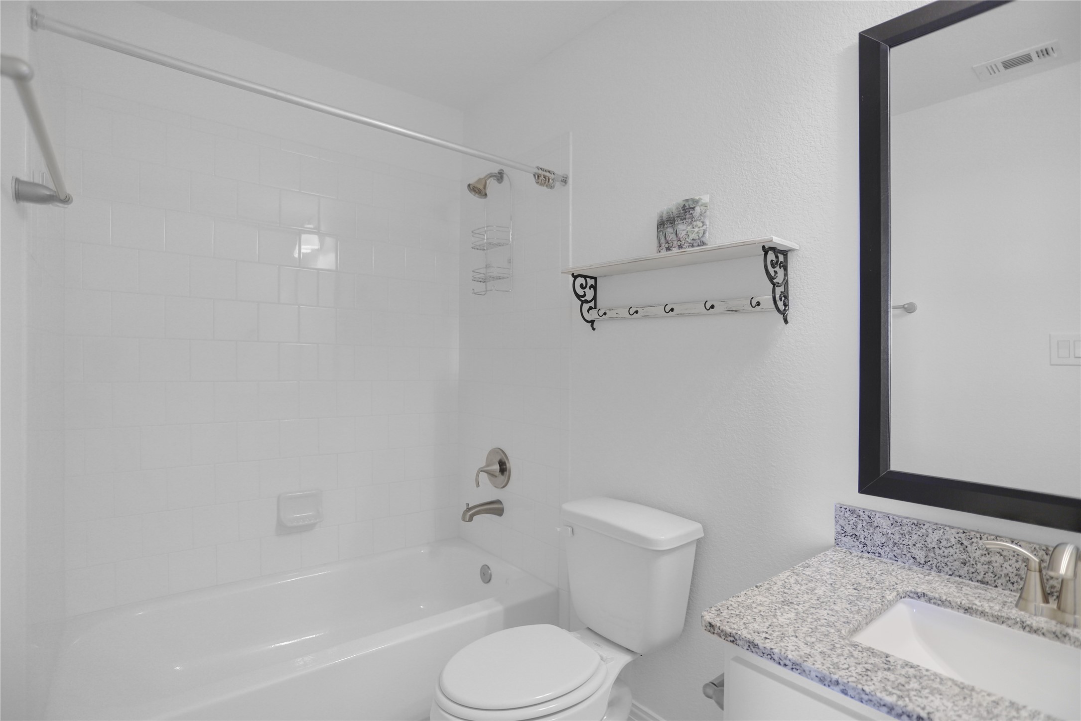 2718 Ripe Amber Cup Court Richmond, TX 77406 - Photo 23 of 43 a bathroom with a granite countertop sink toilet and shower