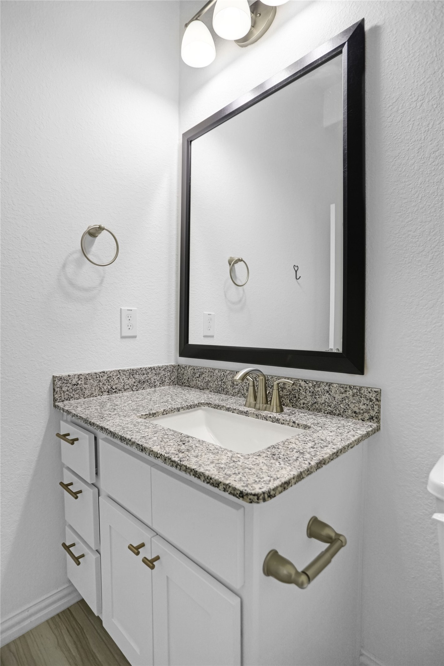 2718 Ripe Amber Cup Court Richmond, TX 77406 - Photo 35 of 43 a bathroom with a granite countertop sink and a mirror
