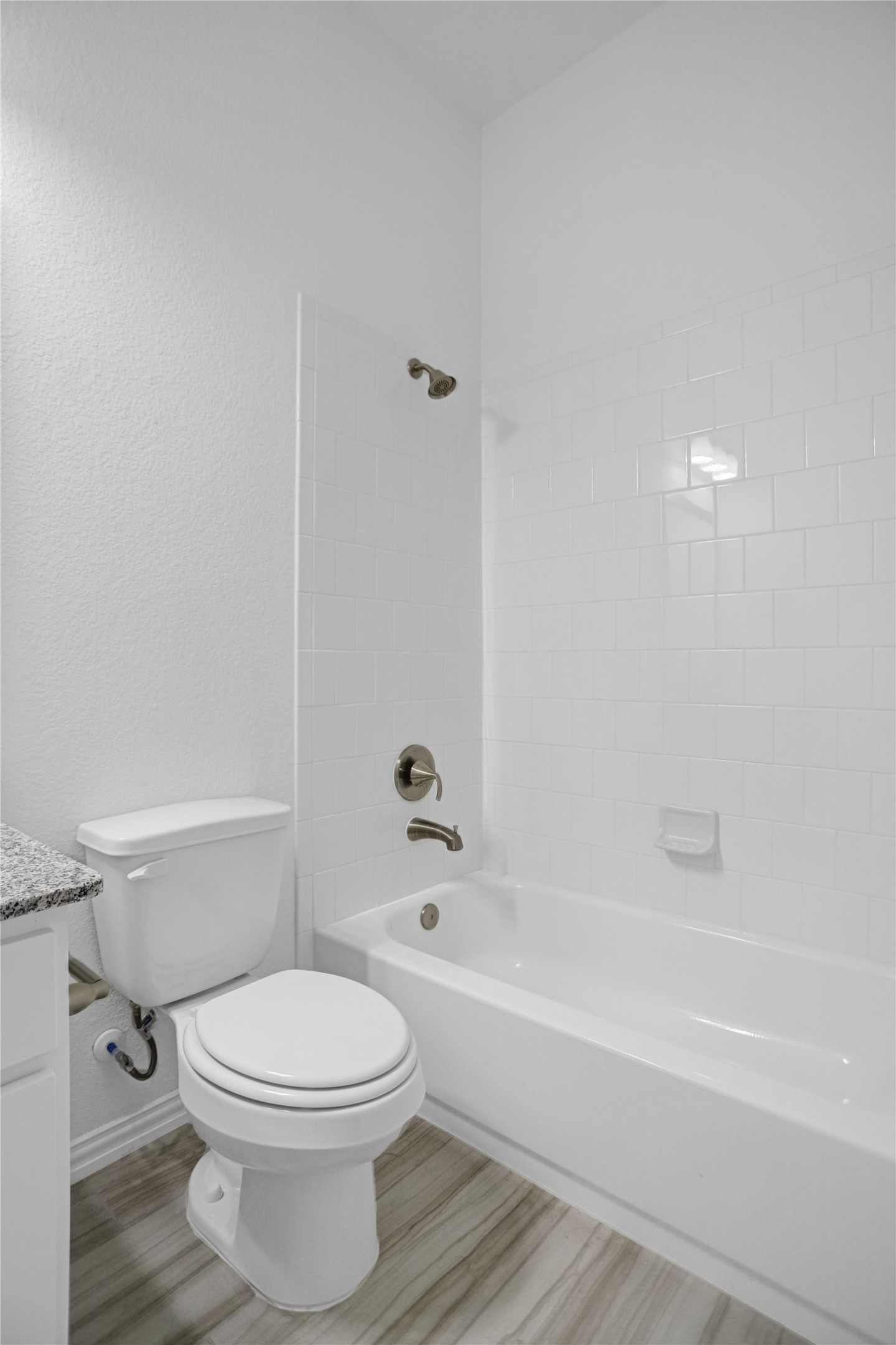 2718 Ripe Amber Cup Court Richmond, TX 77406 - Photo 36 of 43 a bathroom with a toilet and a bath tub