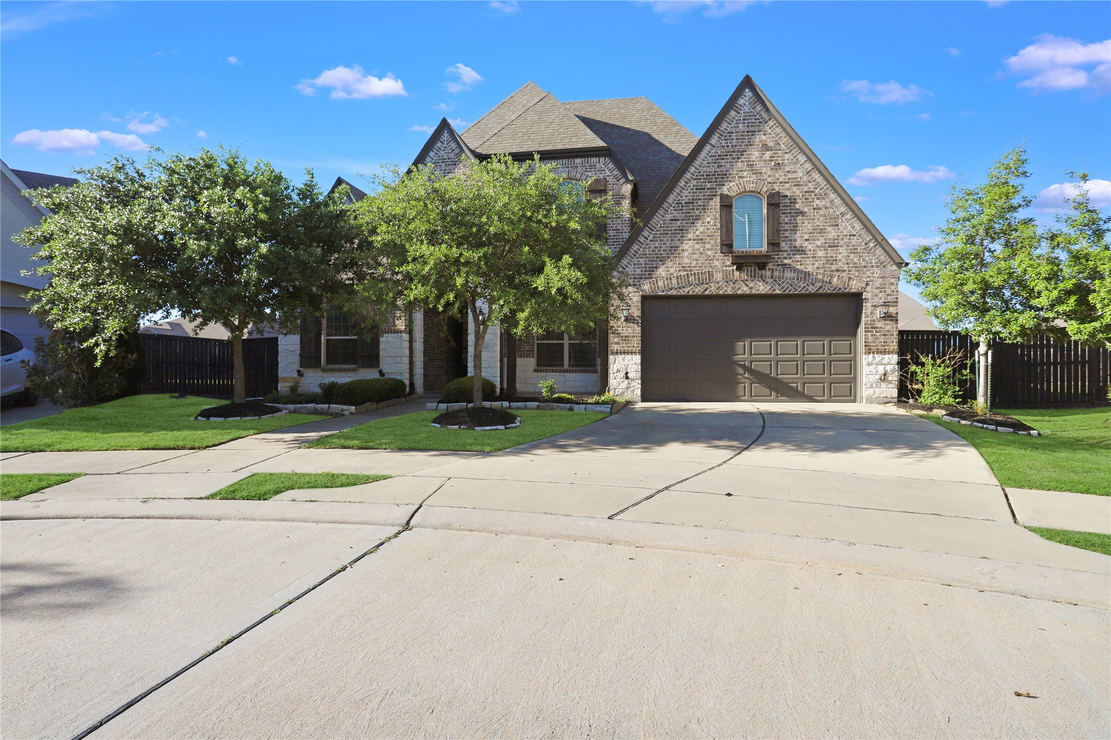 2718 Ripe Amber Cup Court Richmond, TX 77406 - Photo 38 of 43 a front view of a house with a yard and trees