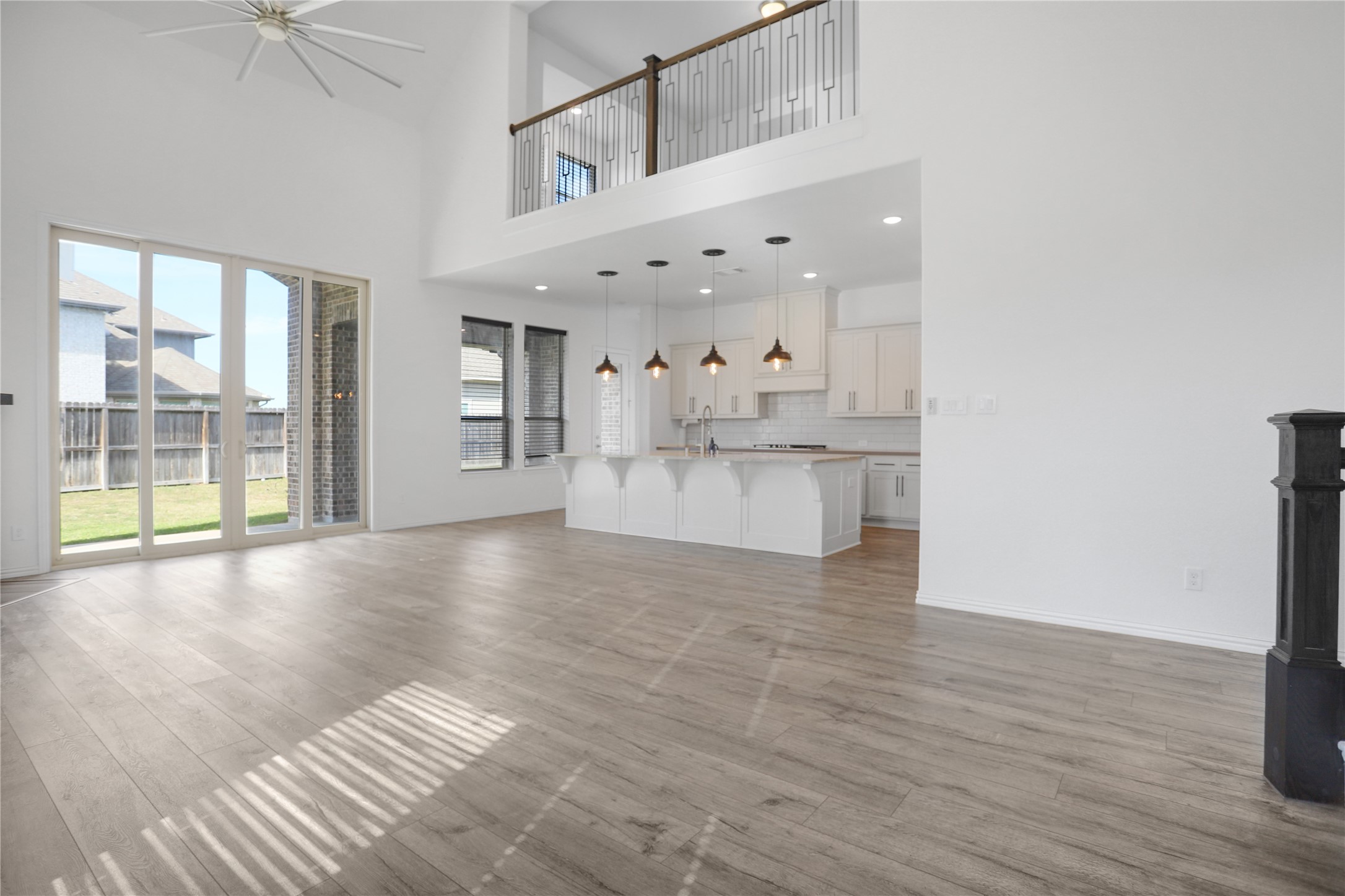 2718 Ripe Amber Cup Court Richmond, TX 77406 - Photo 5 of 43 a view of an empty room with wooden floor and a window