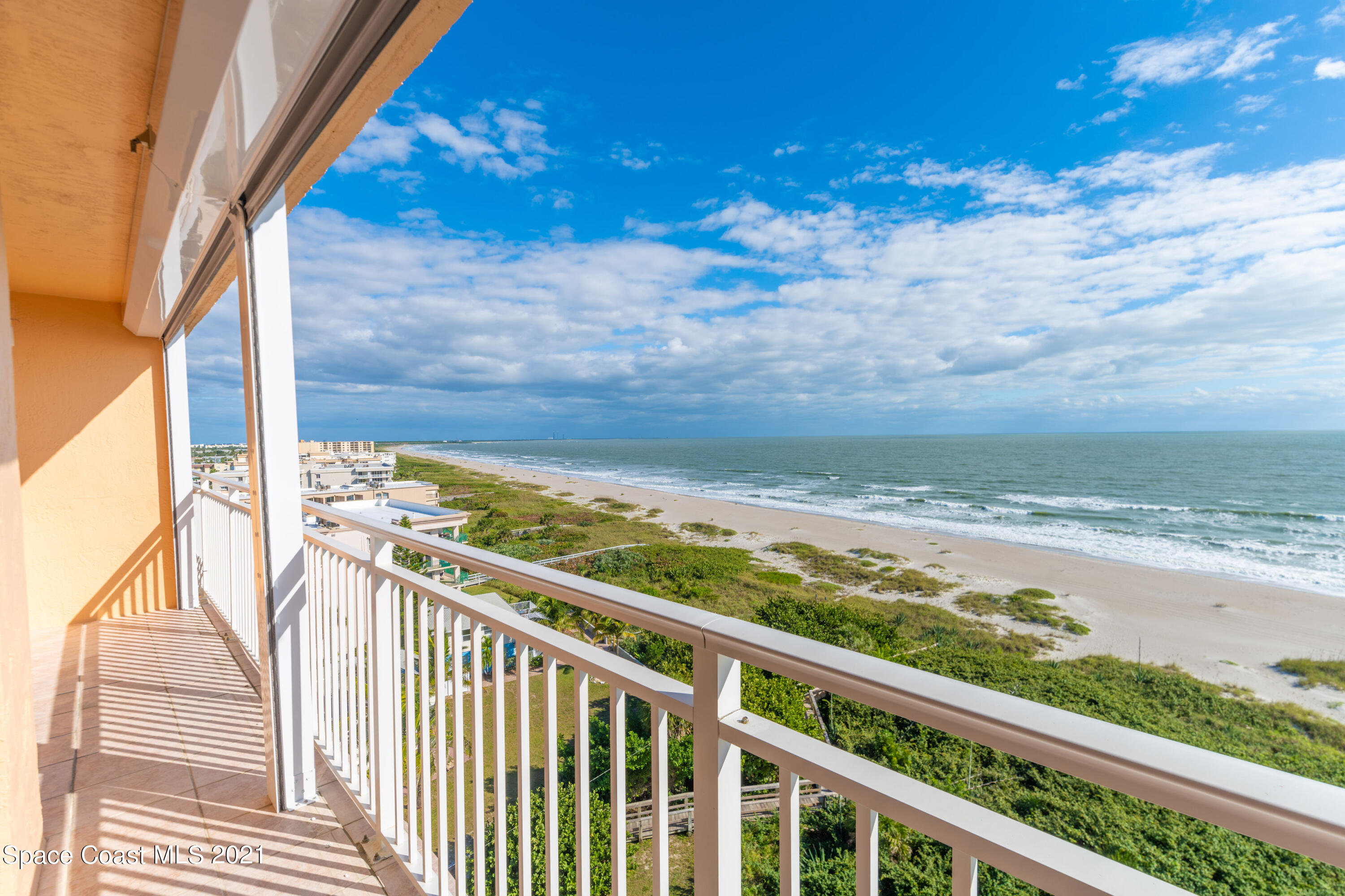 6770 Ridgewood Avenue, Unit 1002 Cocoa Beach, FL 32931 - Photo 5 of 16 a view of a balcony with an ocean view