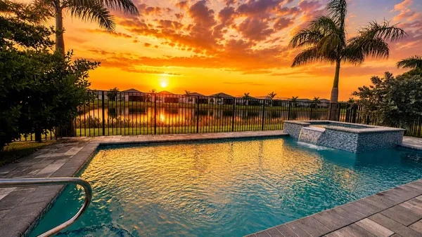 a view of a swimming pool with a lake view