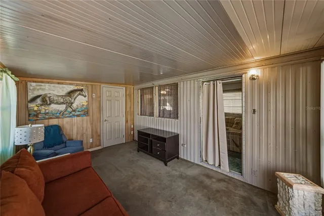a view of a livingroom with furniture and windows